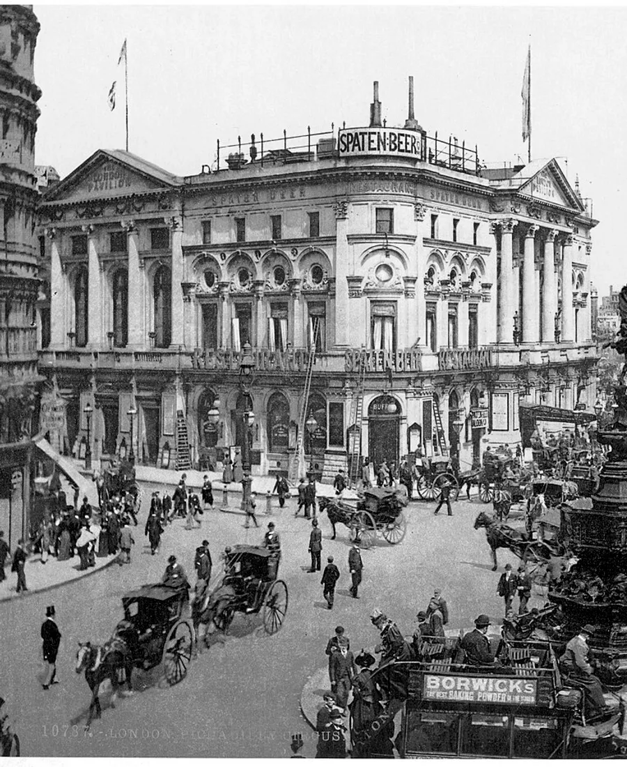 Piccadilly Circus, London, with carriages and omnibuses around the Shaftesbury Memorial Fountain, 1890s